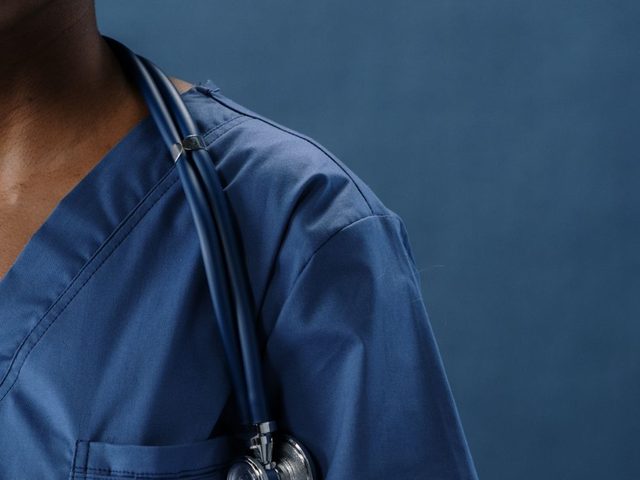Nurse in scrubs with a stethoscope